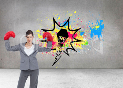 Composite image of businesswoman with boxing gloves