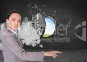 Composite image of unsmiling asian businesswoman pointing