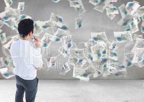 Composite image of businessman holding glasses