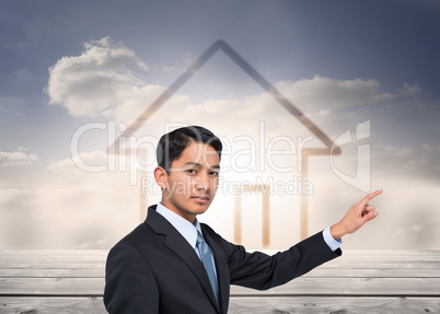 Composite image of stern asian businessman pointing