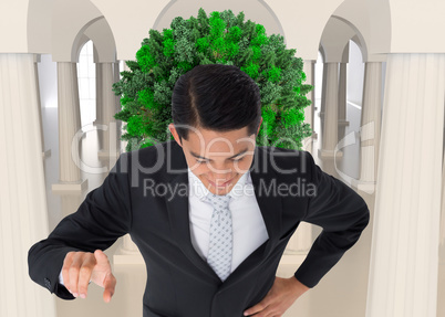 Composite image of smiling asian businessman pointing