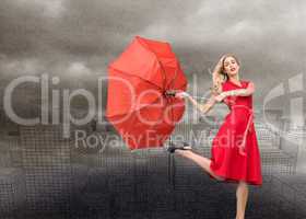 Composite image of elegant blonde holding umbrella