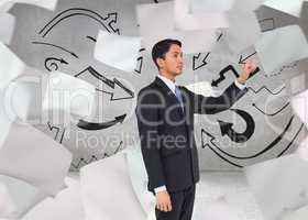 Composite image of serious asian businessman pointing