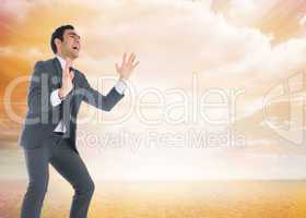 Composite image of screaming businessman catching