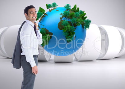 Composite image of smiling businessman standing