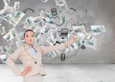 Composite image of unsmiling asian businesswoman pointing