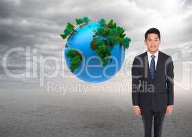 Composite image of happy businessman looking at camera