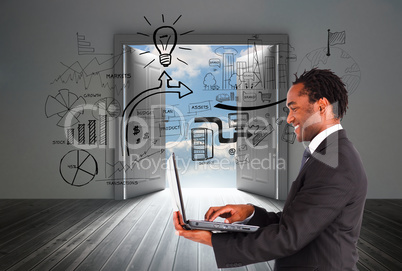 Composite image of businessman working on laptop