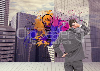 Composite image of young businessman standing back to camera scr