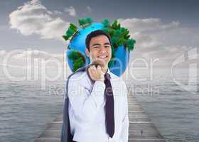 Composite image of smiling businessman standing