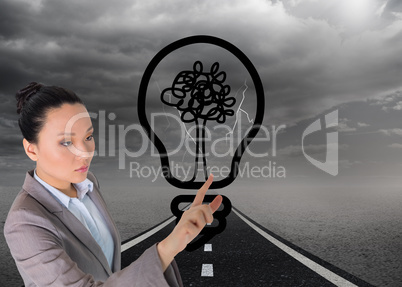 Composite image of unsmiling asian businesswoman pointing