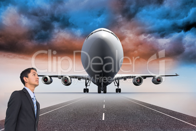 Composite image of serious asian businessman