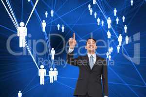 Composite image of smiling asian businessman pointing