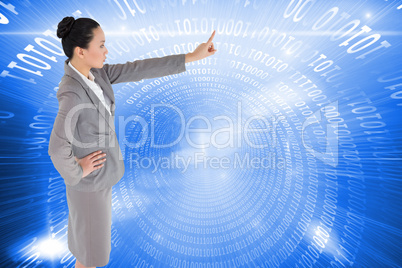 Composite image of unsmiling asian businesswoman pointing