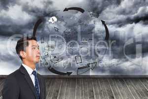 Composite image of graphic on wall with stormy sky