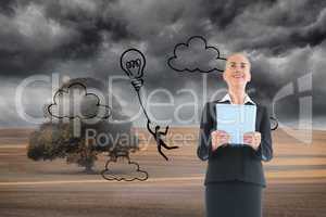 Composite image of businesswoman holding new tablet