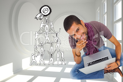 Composite image of thoughtful man sitting on floor using laptop