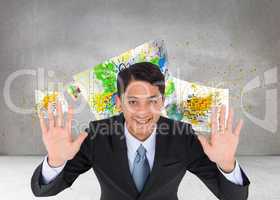 Composite image of smiling asian businessman holding hands up