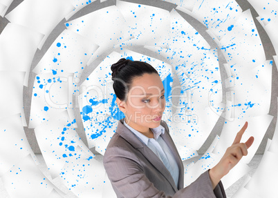 Composite image of unsmiling asian businesswoman pointing