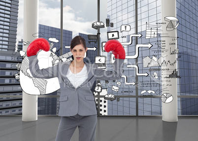 Composite image of businesswoman with boxing gloves