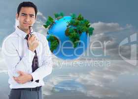 Composite image of thinking businessman holding glasses