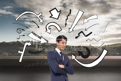 Composite image of unsmiling casual businessman with arms crosse