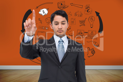 Composite image of serious asian businessman pointing Composite image of serious asian businessman pointing