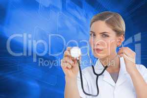 Composite image of serious nurse listening with stethoscope