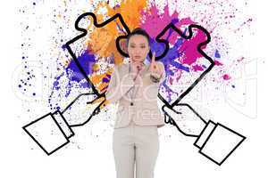 Composite image of thoughtful asian businesswoman pointing