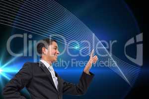 Composite image of smiling asian businessman pointing