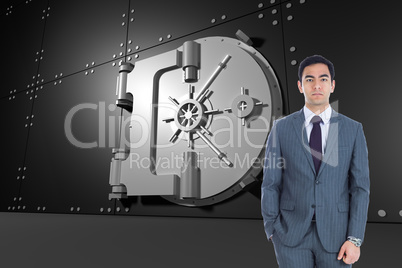 Composite image of unsmiling businessman standing