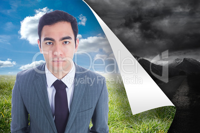 Composite image of unsmiling businessman standing