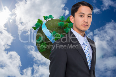 Composite image of serious asian businessman Composite image of serious asian businessman