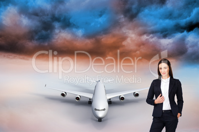 Composite image of portrait of a confident businesswoman standin