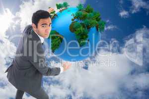 Composite image of unsmiling businessman catching