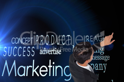 Composite image of asian businessman pointing