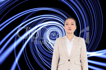 Composite image of unsmiling asian businesswoman