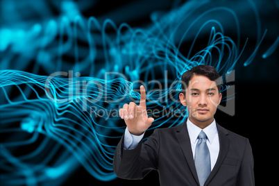 Composite image of stern asian businessman pointing