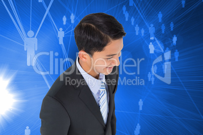 Composite image of smiling asian businessman