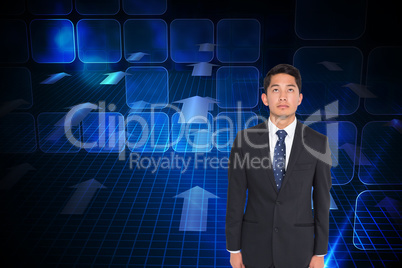 Composite image of stern businessman looking up