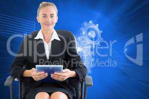 Composite image of businesswoman sitting on swivel chair with ta