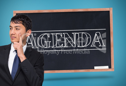 Composite image of thoughtful businessman touching