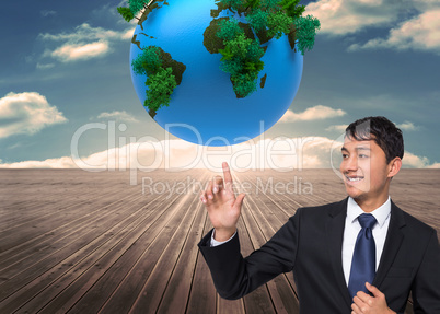 Composite image of smiling businessman touching