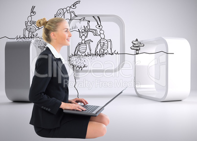 Composite image of businesswoman using laptop