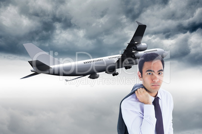 Composite image of unsmiling businessman standing