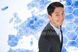 Composite image of smiling asian businessman