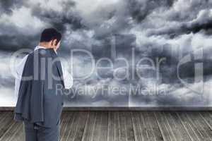 Composite image of businessman standing