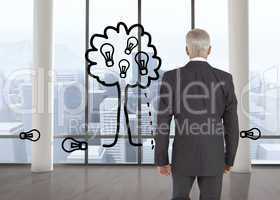 Composite image of businessman walking away from camera
