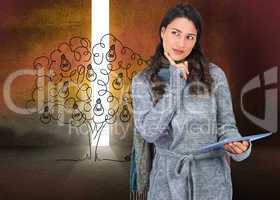 Composite image of pensive model wearing winter clothes holding