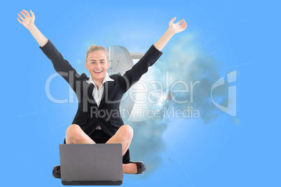 Composite image of businesswoman sitting in front of laptop with